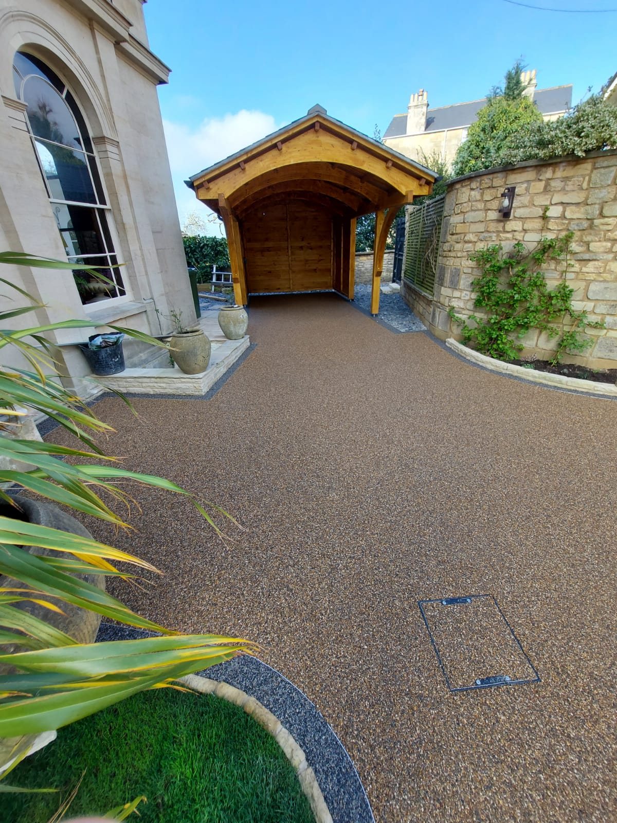Resin bound path and parking to an oak carport